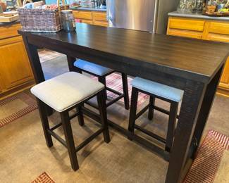 5' x 20" x 36"tall bar table with 3 barstools. Table has power strip built in . Nice! Heavy!