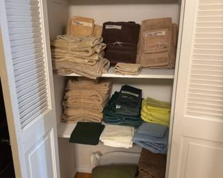 Lots of bath towels, bed linens here. Super soft vintage flannel curtains down below