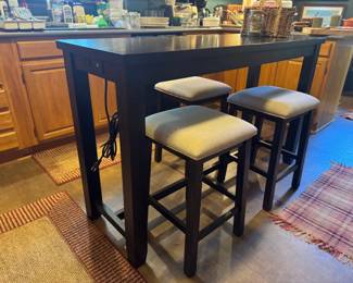 5' x 20" x 36"tall bar table with 3 barstools. Table has power strip built in . Nice! Heavy!