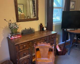 Vintage wooden desk and matching mirror. That desk chair has a matching brother too