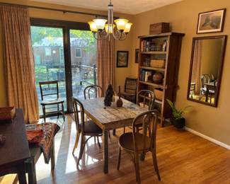 Charming dining room. So many good ol tables here! There are 9 bentwood chairs total, 5 of them have matching seats