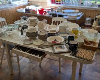 Kitchen table with 4 painted chairs. Formica top over enamel table. Pull- out silverware drawer.