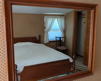 Queen bed on an adapted full size frame. Matching mirror, but will sell separately.