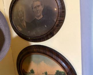 Antique photographs in oval glass frames