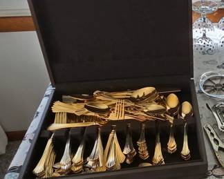 Vintage gold-plated stainless steel flatware service set in orignal storage chest