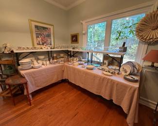 Lots of collectible dishes, primitive floor lamp, vintage tables