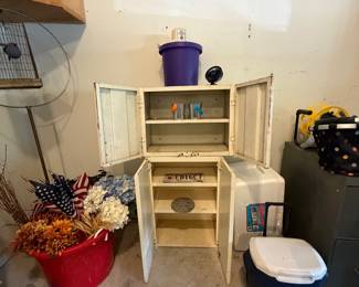 Metal cabinets, rolling cooler, florals and flags