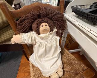 Cabbage Patch baby, vintage chair and small writing desk