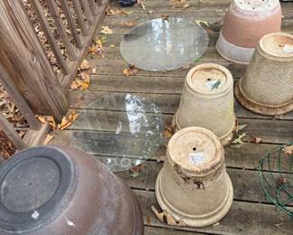 Planters and two pieces of round glass