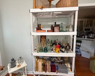 Lots of vintage collectible bottles, games and books, wall plate rack