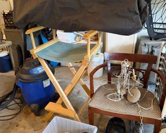 Garage items, extension cords, small chandelier, sack lounger