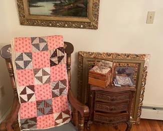 Painting/quilt/commode corner: Victorian reverse-painted glass landscape in ornate gilt frame; antique hand-pieced quilt; carved French Provincial commode