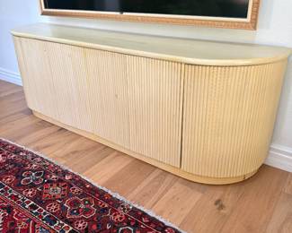 MCM light-colored wooden credenza with a fluted front panel design