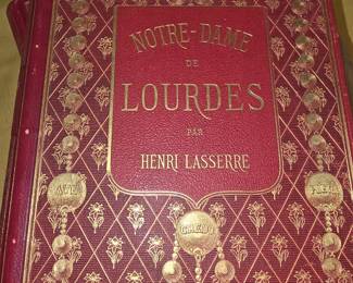 Leather 1870s French account of the 1858 Marian apparitions of Our Lady of Lourdes to Saint Bernadette Soubirous.
