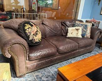 Super comfy and beautifully well-worn vintage leather sofa with nail head trim.