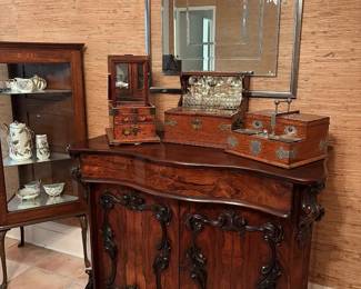 Beautiful collection of English antiques including late 19th century rosewood sideboard, tantalus boxes, smoker’s box and traveler’s vanity chest.