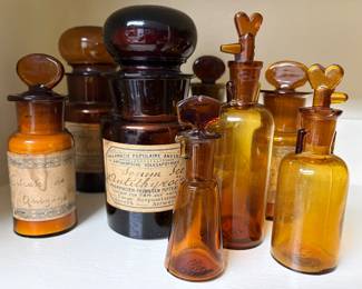 Collection of early 20th century French and Belgian apothecary bottles.
