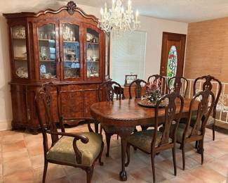 Gorgeous dining room suite including reproduction European style china cabinet and antique English table and chairs.