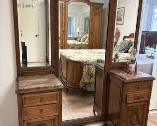 Antique French walnut vanity dresser with tri-fold mirror.