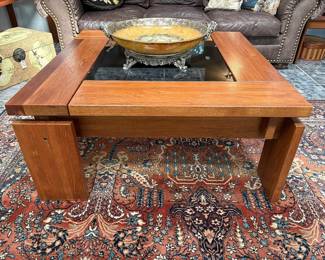 Mid-Century Modern coffee table with smoky glass top.