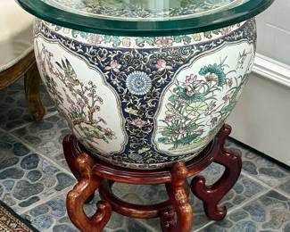 Chinese Republic Period hand-painted fish bowl with floral and bird decoration on carved with stand with beveled glass top.