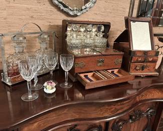 Collection of antique English decanter sets and boxes, Waterford crystal, and barware.