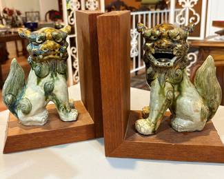 Pair of antique Japanese glazed ceramic foo dogs mounted as bookends.