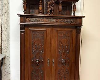 Late 19th century English Renaissance Revival mahogany cabinet with blind fretwork.
