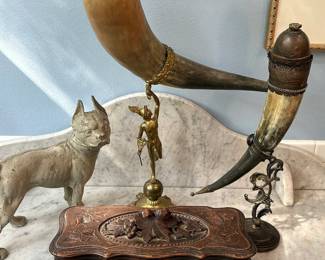 Antique drinking horns and Black Forest carved wood glove box.