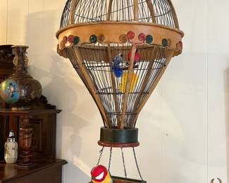 Amazing collection of vintage and antique birdcages including this delightful hot air balloon cage