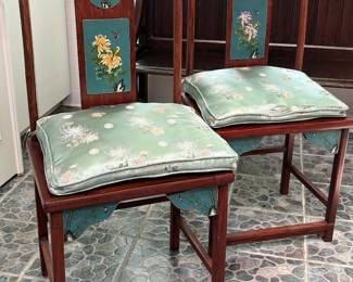 Pair of vintage Chinese yoke-back chairs with inset cloisonné panels and seat spandrels and silk cushions.