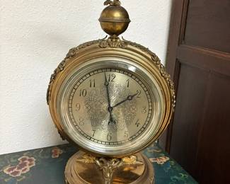 Antique neo-classical style gilt bronze mantel clock with eagle and rams head.