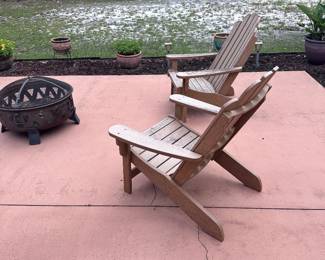 Adirondack chairs and a fire pit