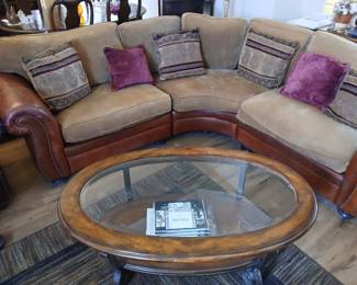 Curved sectional sofa & Oval Glass top coffee table