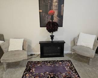 Small electric fireplace and a pair of occasional chairs