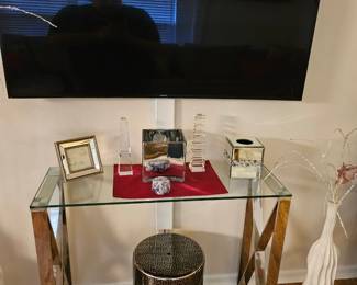 Smart TV and glass and chrome console table