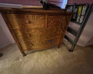 Antique tiger oak serpentine dresser