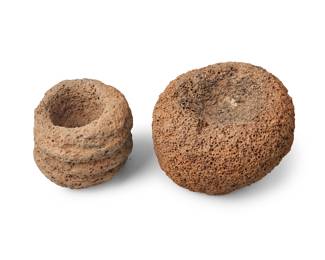 201 Two Hawaiian stone lamps Hawaiian Islands 2 pieces Diameters 3 1/2 in. and 5 1/4 in. Estimate: $500 - $700