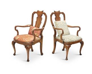 313 Two Queen Anne style mahogany armchairs 20th century Each with fiddle back, shepherd's crook armrests, and later fabric upholstery 2 pieces Height of each 41 1/2 in., width 26 1/2 in., depth 27 in. Estimate: $700 - $900