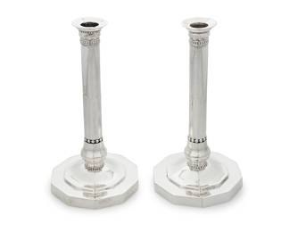 38 A pair of Georg Jensen .830 silver candlesticks Circa 1920 Designed 1919 by Johan Rohde, model 286 Each marked: GI 830 S / [oval maker's mark] / 1920 / 286; one with circular designer's monogram 2 pieces Height of each 9 1/4 in. Total weight 41.4 oz. troy approximately Estimate: $2,000 - $3,000