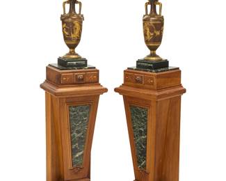 283 A pair of Renaissance Revival lamps on pedestals Circa 1875 Each painted metal urn-form lamp issuing a single light with a later cut glass shade, raised on a wood pedestal with carved and gilt accents and inset front and top marble panels, electrified 2 pieces Height of each lamp 19 1/2 in., width 7 in., depth 6 1/2 in.; height of shades 9 1/8 in., diameter 8 1/2 in.; height of pedestals 39 1/4 in., width 15 in., depth 12 1/8 in. Estimate: $800 - $1,200