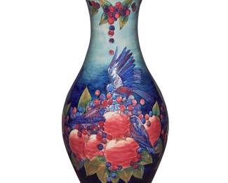 254 A massive Moorcroft glazed earthenware 'Finches and Pomegranate' vase Designed by Sally Tuffin (b. 1938), circa 1994 Impressed: MOORCROFT / MADE IN ENGLAND [bell]; signed and dated: S. T. DES. / 7.11.1991; also signed and dated: J Moorcroft / 30-9-94; further marked: WM [conjoined] Height 26 1/8 in., diameter 12 3/4 in. Estimate: $800 - $1,200