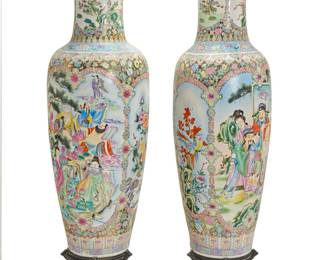 374 A near pair of Chinese Famille Rose porcelain floor vases Late 20th century Decorated with peonies, bands of meandering motifs, ruyi-form floral medallions, and alternating registers depicting floral vignettes and figural scenes, raised on hardwood stands Each stamped with apocryphal red mark for Qianlong period (1735-1796) and applied sticker: MADE IN CHINA 2 pieces Height of larger 5 ft. 3 in., diameter 20 in.; height of smaller 5 ft. 1 1/2 in., diameter 21 1/2 in.; height of stands 10 3/4 in., diameter 17 1/4 in. Estimate: $800 - $1,200