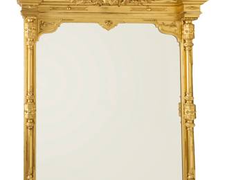 160 A large Louis XVI style giltwood mirror 19th century With columnar sides crested by palmettes centering an ornate cornice with central bust Height 80 in., width 60 1/2 in., depth 13 1/2 in. Estimate: $800 - $1,200