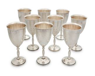13 A set of nine sterling silver goblets Early 20th century Each marked: MMR / STERLING / 925 9 pieces Height of each 6 1/4 in., diameter 2 7/8 in. Total weight 43.3 oz. troy approximately Estimate: $800 - $1,200