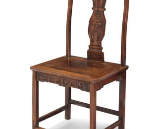 71 A Northern Chinese rosewood side chair Late Qing dynasty (1644-1912) or later With a shaped splat above an apron carved with cloud motifs, raised on straight legs joined by a box stretcher Height 41 1/2 in., width 21 in., depth 16 3/4 in. Estimate: $500 - $700