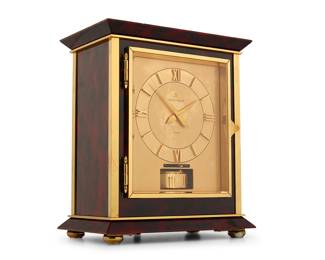 385 A Jaeger-LeCoultre 'Atmos' mantel clock Late 20th/early 21st century The dial bearing Roman numerals, in a glazed faux tortoiseshell case Dial with factory marks Height 10 3/4 in., width 9 in., depth 5 5/8 in. Estimate: $700 - $1,000