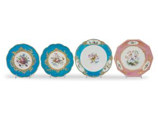 172 A group of four Sèvres style porcelain articles 18th/19th century Comprising two similar bleu celeste low compotes, a fond rose ten sided plate and a bleu celeste plate Blue painted interlaced Ls marks, some enclosing letters 4 pieces Height of compote 1 1/2 in., diameter 9 in.; diameter of bleu celeste plate 10 in.; width of rose plate 9 5/8 in. Estimate: $600 - $800