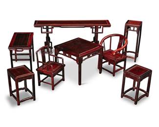 69 A group of Chinese miniature wood furniture 20th century Comprising three tables of different sizes, a pair of plant stands, pair of side tables, set of four horseshoe chairs, and a set of six armchairs, in a custom box 17 pieces Height of largest table 5 1/4 in., width 12 3/8 in., 2 3/4 in.; height of box 7 3/4 in., width 20 in., depth 20 in. Estimate: $3,000 - $5,000