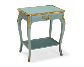 156 A Louis XV style gilt bronze mounted side table 20th century Raised on cabriole legs joined by an undertier Height 25 1/4 in., width 21 1/4 in., depth 15 1/4 in. Estimate: $500 - $700